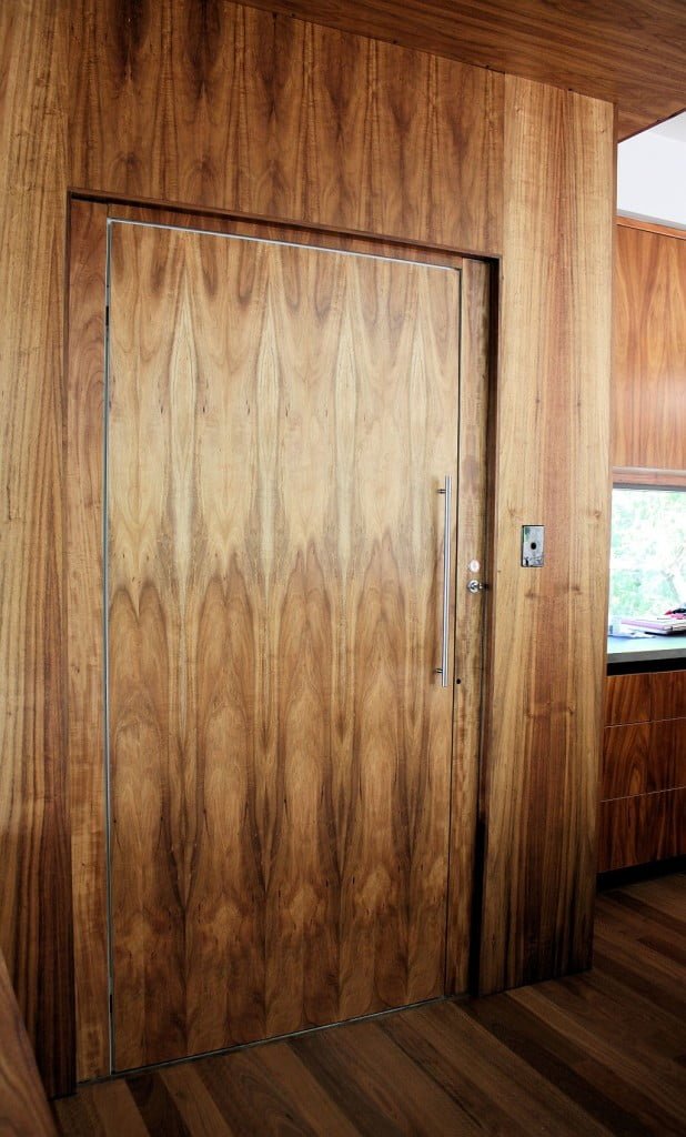 Lift Shop lift door concealed within the surrounding wall finish