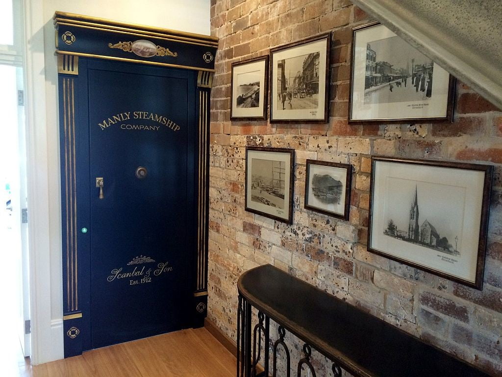 Lift Shop lift door concealed within the surrounding wall finish