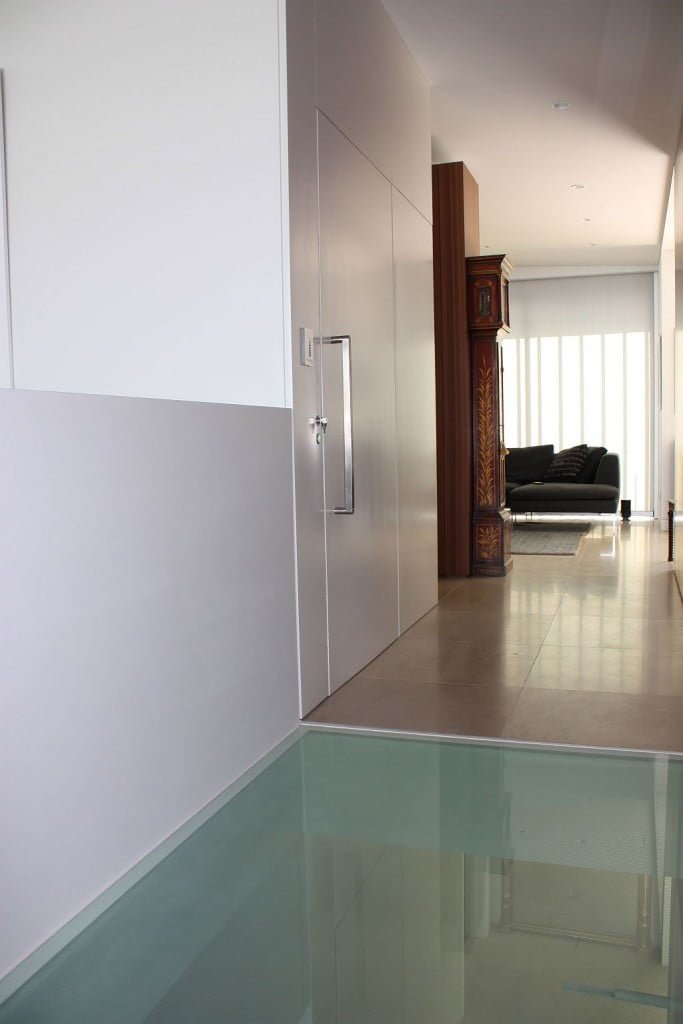 Lift Shop lift door concealed within the surrounding wall finish