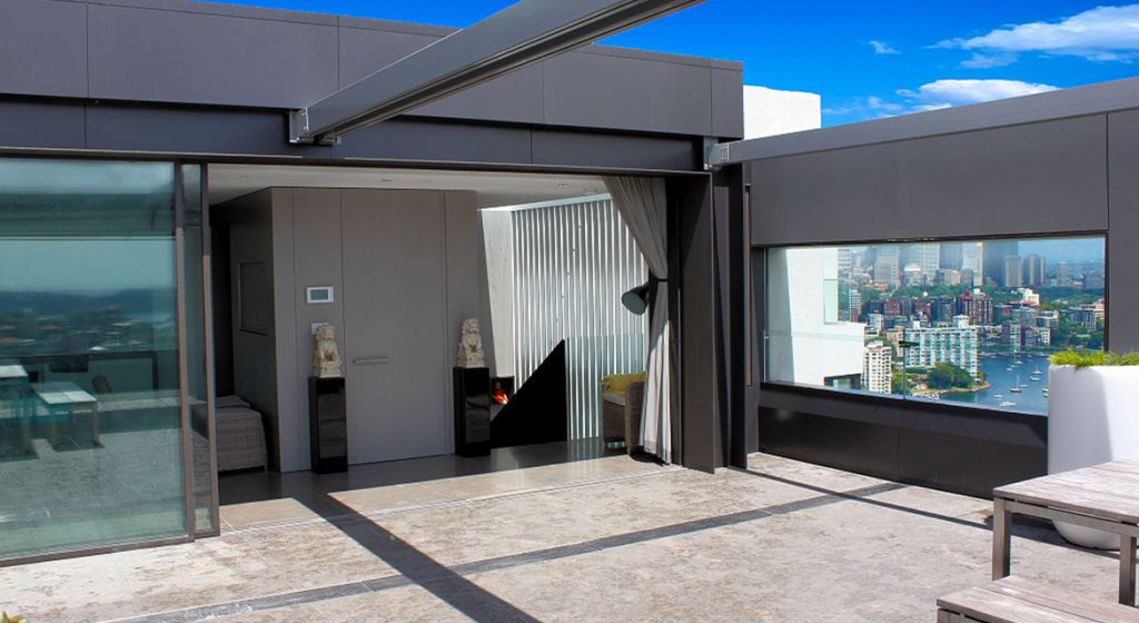 Lift Shop lift door concealed within the surrounding wall finish