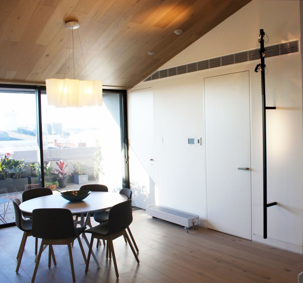 Lift Shop lift door concealed within the surrounding wall finish