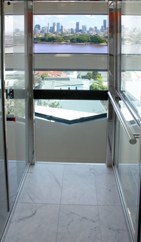 The view from inside the lift cabin across the river to the Brisbane city skyline