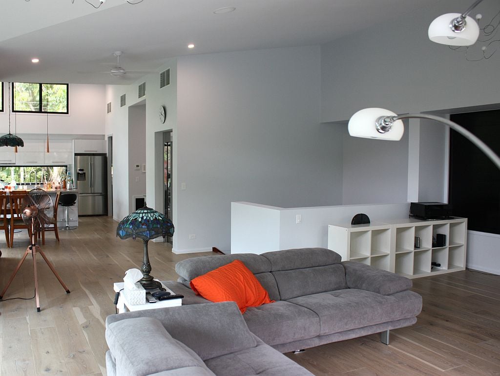 Home with couches, lamps, and fan