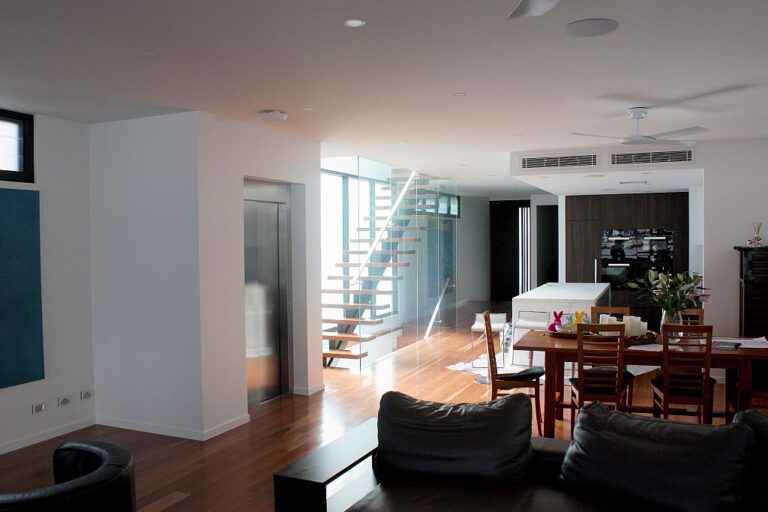 wide elevator near stairs in a home