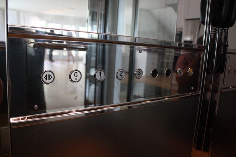 Horizontal car operating panel in polished stainless steel with floor buttons G, 1, 2 and 3