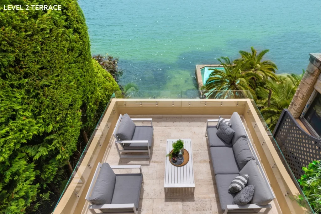 Terrace with harbour view and open doors