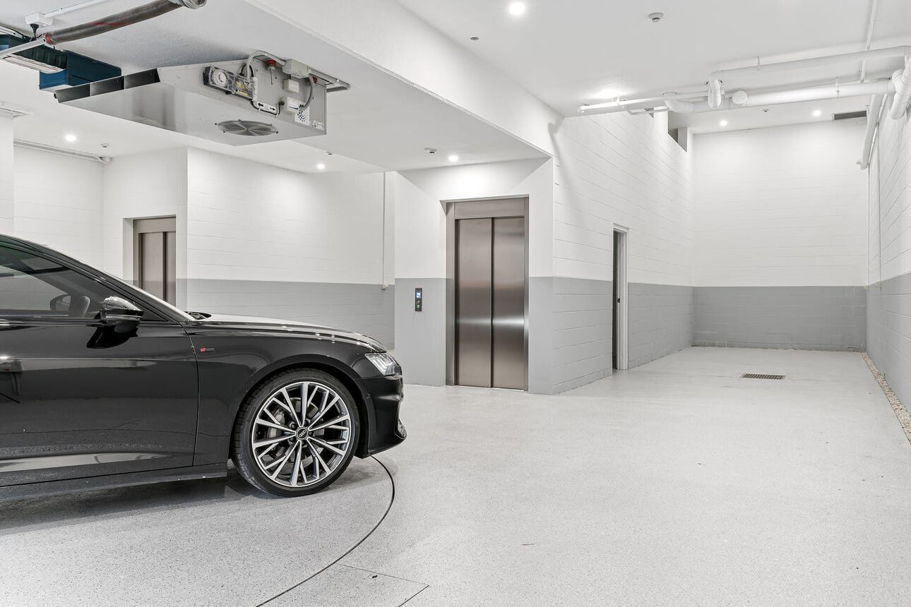 Basement garage with car turntable and Lift Shop A Series lift access