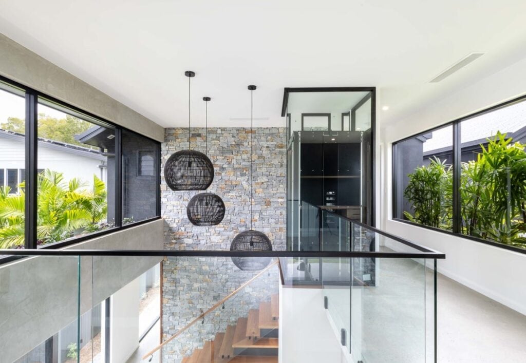 Black wing door of A Series lift as architectural feature