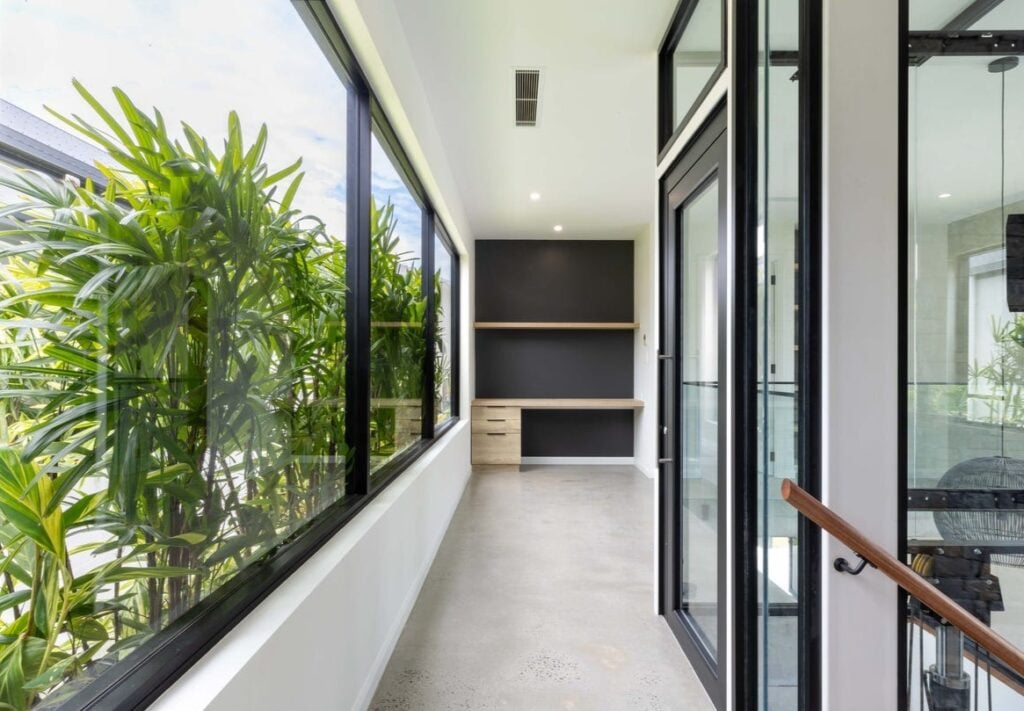 A Series glass shaft lift in modern entryway