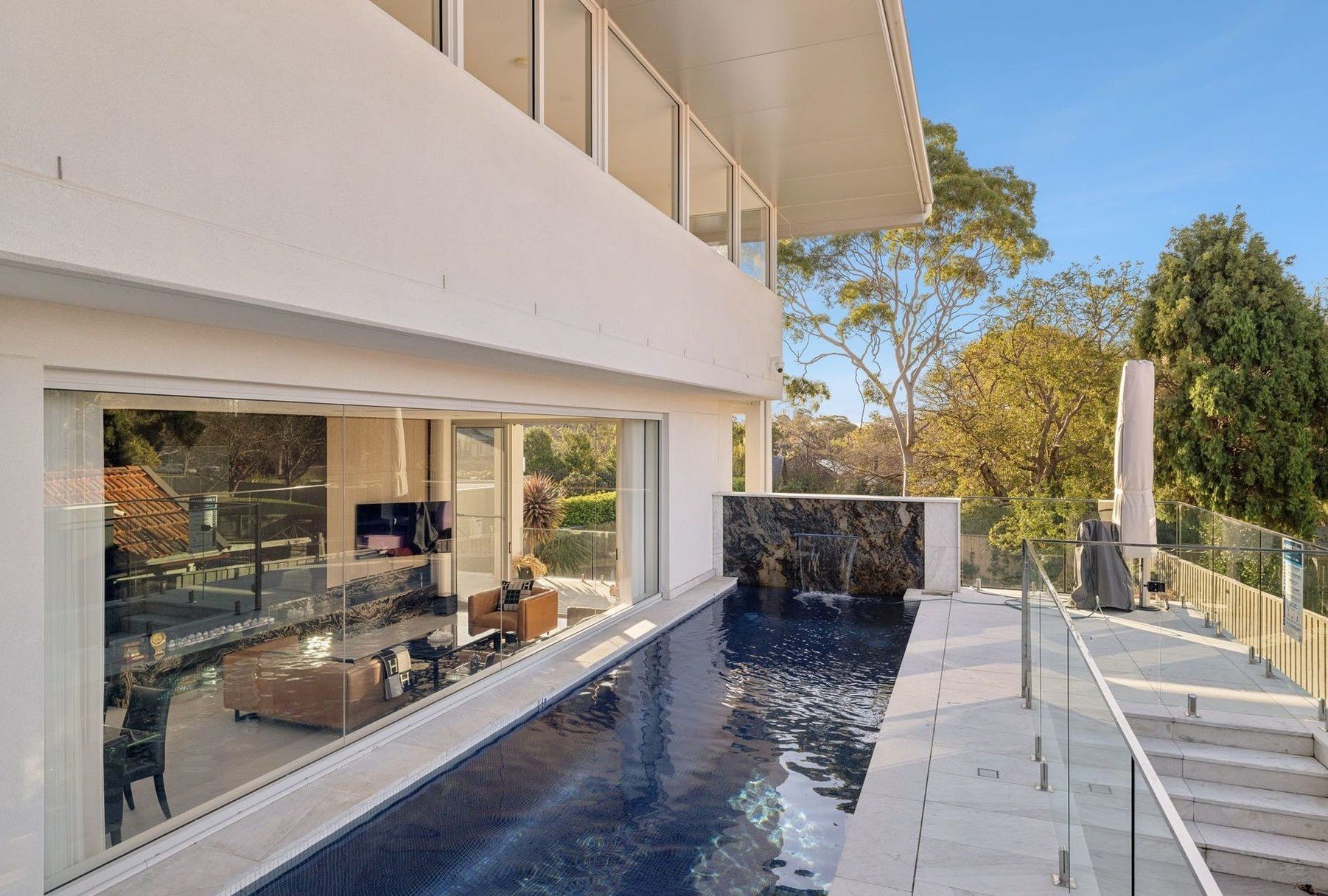 Panoramic glass shaft and cabin design in a luxury residence