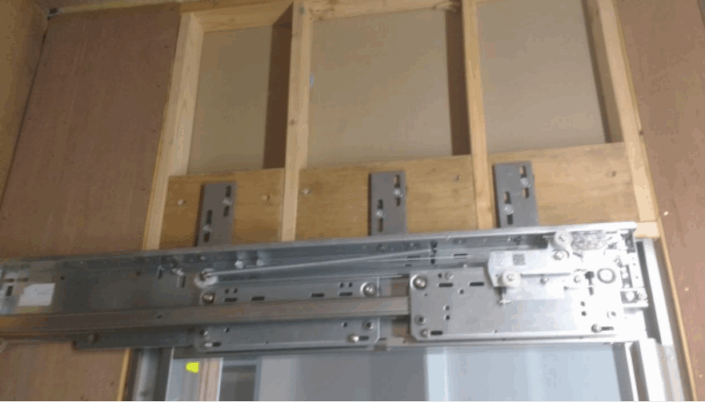 Lift door support and fixing points – masonry and timber backing