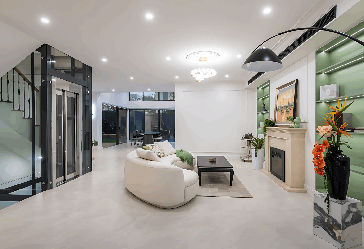 Glass landing doors on a black framed glass lift shaft beside the staircase in a Caringbah South living room