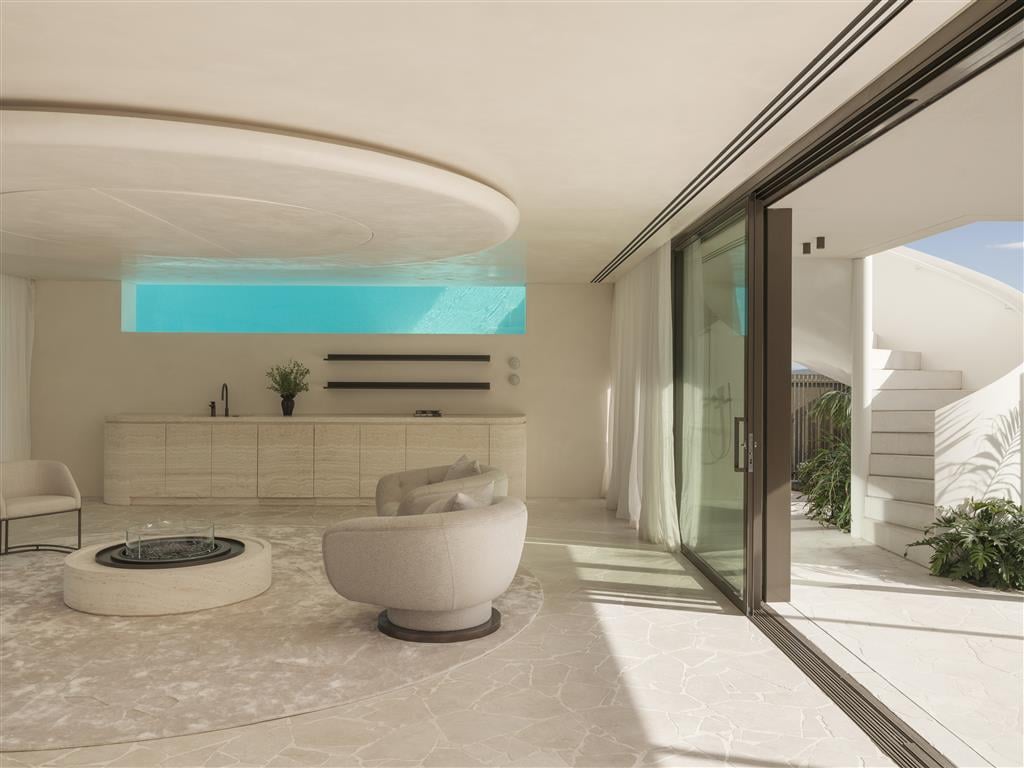 Living room in The Solstice overlooking infinity pool and ocean, with Lift Shop access.