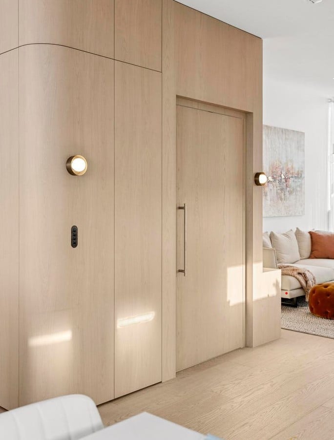 Custom timber-panelled residential lift integrated into luxury townhouse interior