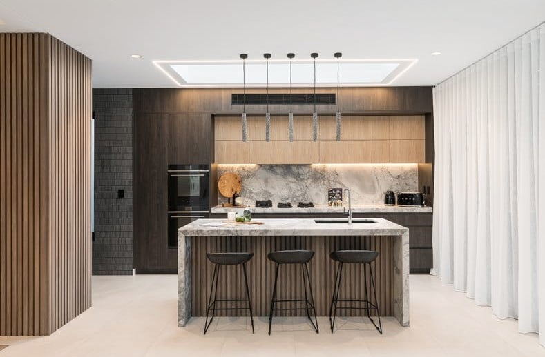 Seamlessly integrated black home lift blending into timber wall joinery in a luxury Caringbah South residence
