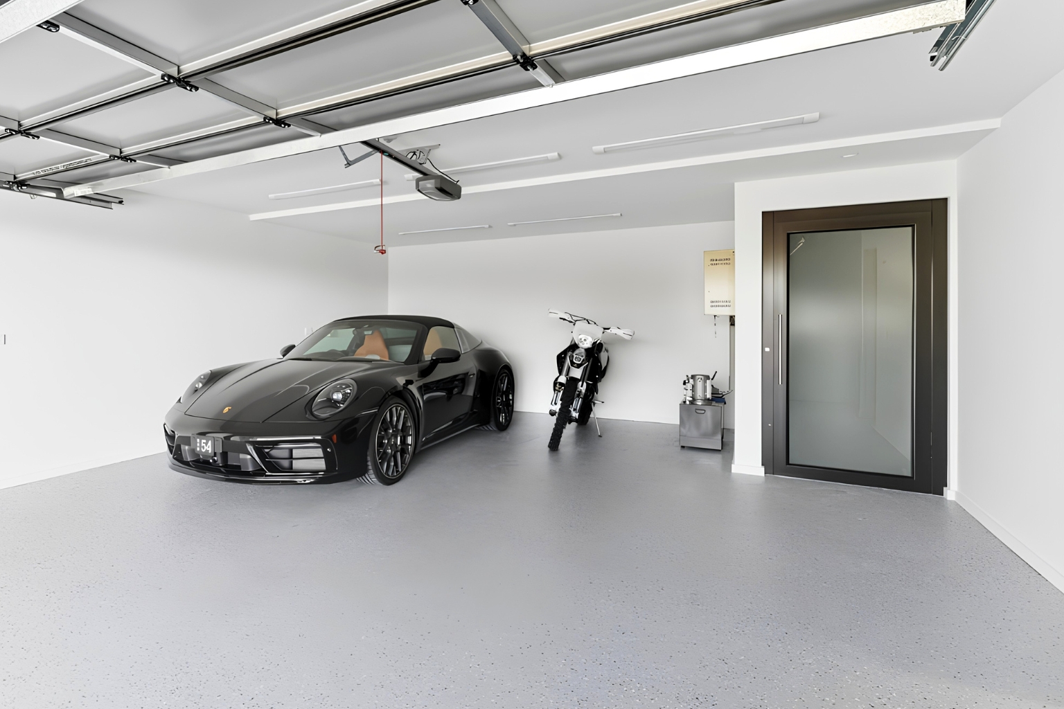 Luxury home elevator with a matt black door and frosted glass, giving direct access from the garage level in the Thirroul home