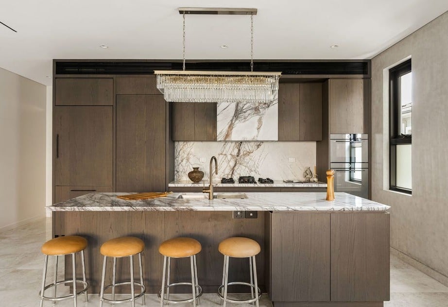 Luxury kitchen with marble island, custom joinery and premium appliances in Cremorne home