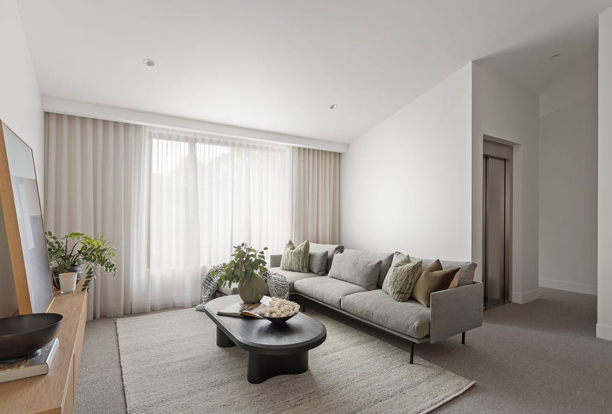 Modern living room with integrated Lift Shop home elevator access in luxury Kew residence