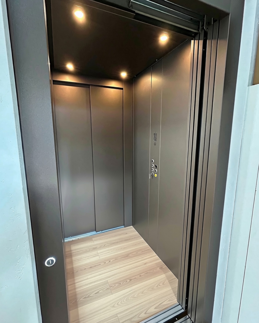 Brushed bronze home lift cabin in the Lift Shop Melbourne showroom