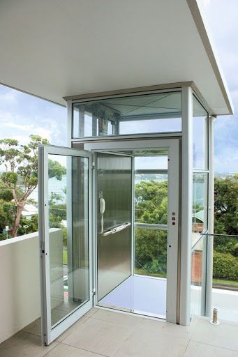 Standard home lift cabin entrance showing the open side of a five-sided cabin