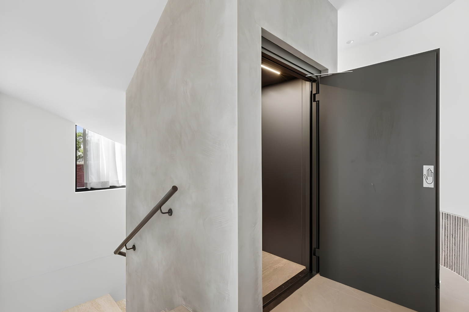 Lift Shop home lift with a brown swing door