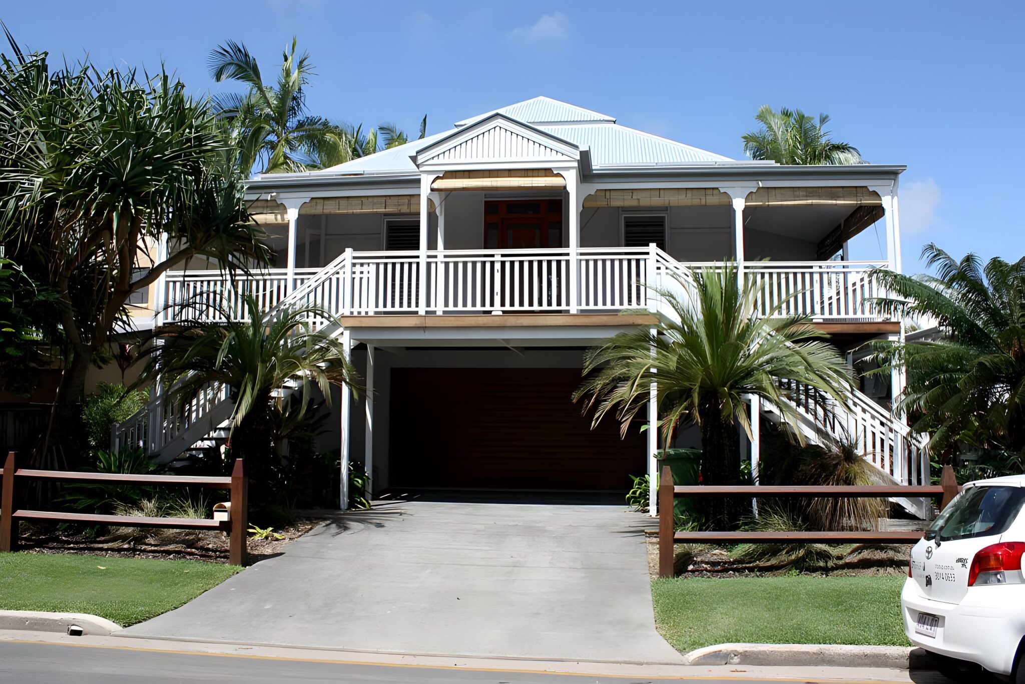 Queenslander-style house with a wide verandah and garage underneath in Noosaville