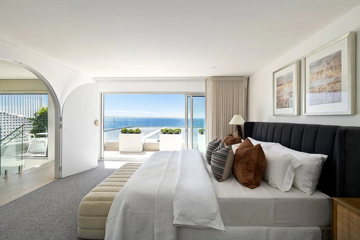 Main bedroom with an arched opening and ocean view in Freshwater Main bedroom with an arched opening and ocean view in Freshwater