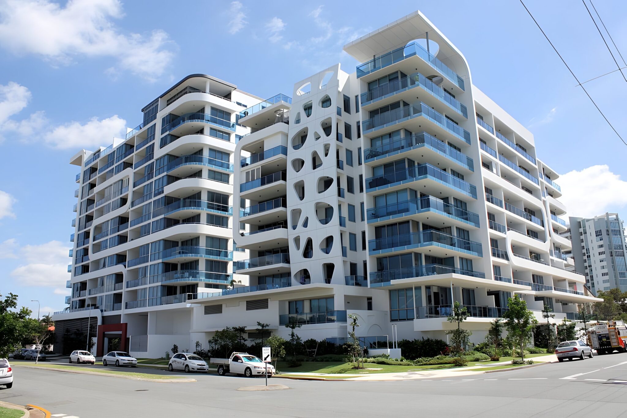 Sapphire Towers apartment building in Labrador, Gold Coast, with white curved balconies and a patterned facade