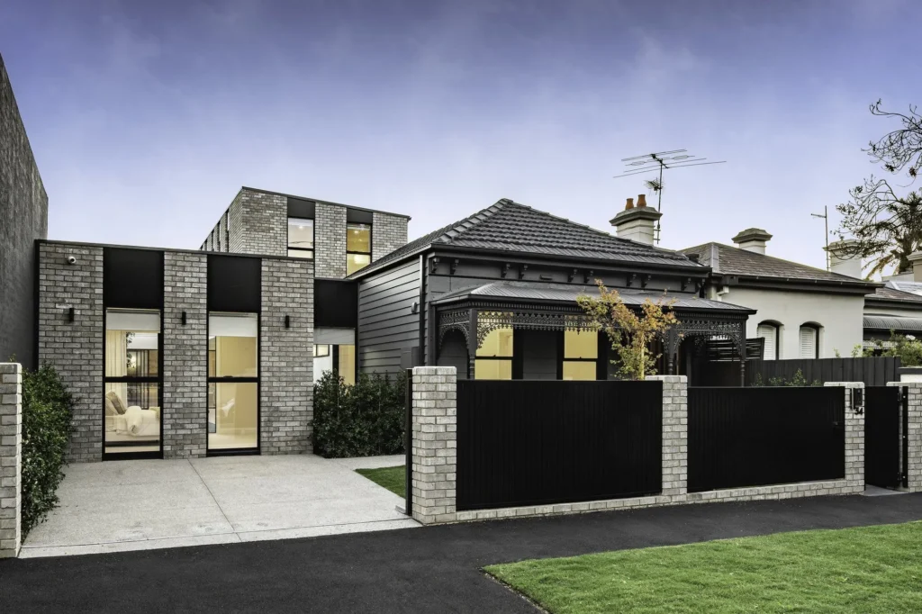 Renovated Victorian facade with new brick and glass addition in South Yarra