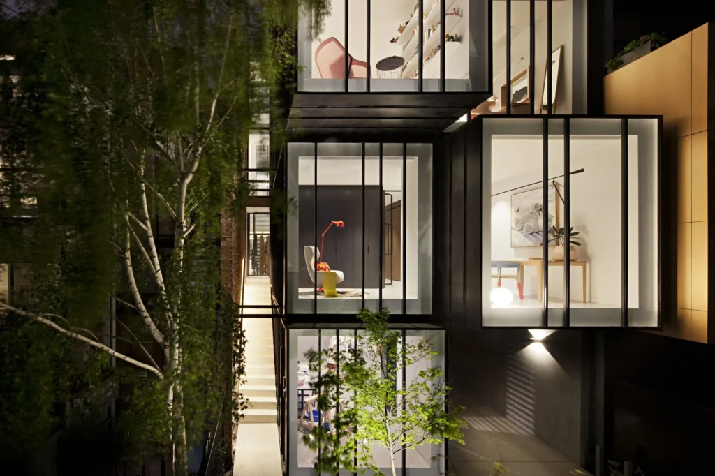 Glass box facade of the St Kilda house in St Kilda, Melbourne, lit at night